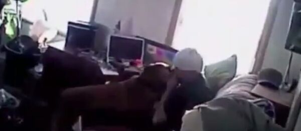 Police body-cam footage released as part of a lawsuit shows officers from the West Jordan Police Department in Utah siccing their dog on a man as he sits on his sofa with his hands raised. Police body-cam footage released as part of a lawsuit shows officers from the West Jordan Police Department in Utah siccing their dog on a man as he sits on his sofa with his hands raised. - Sputnik International