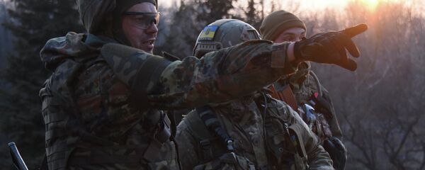 Fighters of the Azov Battalion observe enemy lines from the roof of their base in the town of Shyrokyne, eastern Ukraine Fighters of the Azov Battalion observe enemy lines from the roof of their base in the town of Shyrokyne, eastern Ukraine - Sputnik International