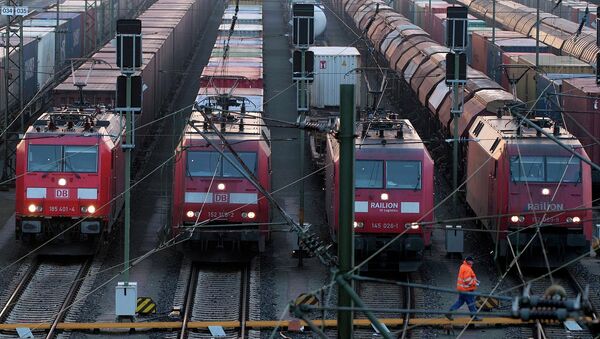 File photo of a worker passing parked locomotives in Europe's biggest marshalling yard in Maschen, near the northern German town of Hamburg, March 10, 2011. - Sputnik International