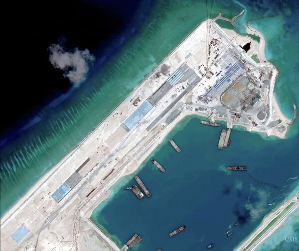 Airstrip construction on the Fiery Cross Reef in the South China Sea is pictured in this April 2, 2015 handout satellite image obtained by Reuters on April 16, 2015 Airstrip construction on the Fiery Cross Reef in the South China Sea is pictured in this April 2, 2015 handout satellite image obtained by Reuters on April 16, 2015 - Sputnik International