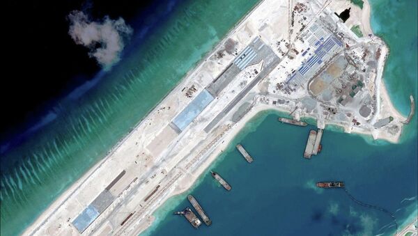 Airstrip construction on the Fiery Cross Reef in the South China Sea is pictured in this April 2, 2015 handout satellite image obtained by Reuters on April 16, 2015 - Sputnik International