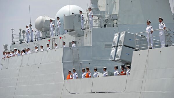 Crew members of Chinese Navy stand guard on the deck of Chinese navy ship Wei Fang - Sputnik International