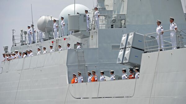 Crew members of Chinese Navy stand guard on the deck of Chinese navy ship Wei Fang - Sputnik International