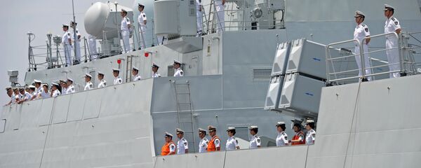 Crew members of Chinese Navy stand guard on the deck of Chinese navy ship Wei Fang - Sputnik International