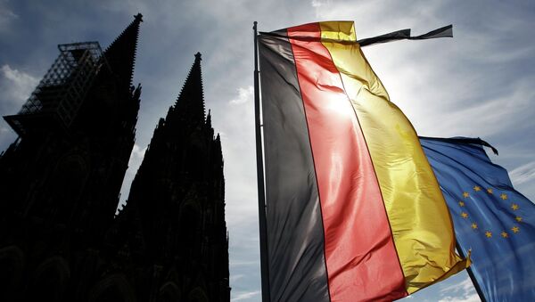 Flags of Germany and the EU fly with black ribbons during a memorial service for the 150 victims of Germanwings flight 4U 9525 in Cologne's Cathedral, April 17, 2015 - Sputnik International