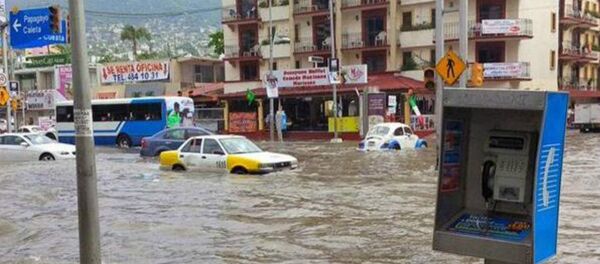 Urban flooding in Acapulco Mexico following large ocean swell Urban flooding in Acapulco Mexico following large ocean swell - Sputnik International