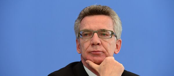 German Interior Minister Thomas de Maiziere attends a press conference to present politically-motivated crime rate in Germany German Interior Minister Thomas de Maiziere attends a press conference to present politically-motivated crime rate in Germany - Sputnik International