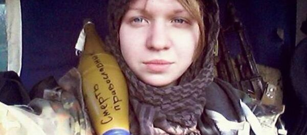 Vita Zaverukha, seen here posing with an RPG shell reading Death to the Orthodox, has been arrested in connection with the murder of two police officers in Kiev. - Sputnik International