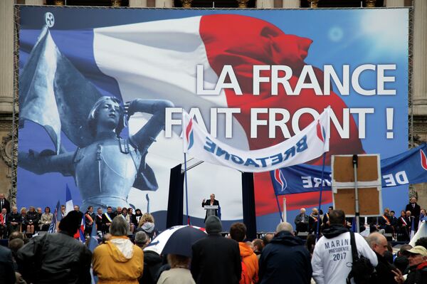 France’s far-right National Front president Marine Le Pen, center, delivers her speech at Opera Plaza during the annual May Day march, in Paris, France, Friday, May 1, 2015. France’s far-right National Front president Marine Le Pen, center, delivers her speech at Opera Plaza during the annual May Day march, in Paris, France, Friday, May 1, 2015. - Sputnik International