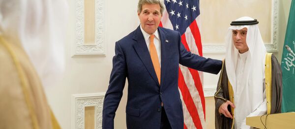 U.S. Secretary of State John Kerry, left, and Saudi Foreign Minister Adel al-Jubeir, right, leave after a joint news conference at Riyadh Air Base in Saudi Arabia, Thursday, May 7, 2015 - Sputnik International