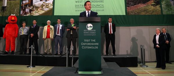 British Prime Minister and Conservative Party Leader David Cameron makes a speech after winning the Witney constituency at the Windrush Leisure Centre, in central England, on May 8, 2015 British Prime Minister and Conservative Party Leader David Cameron makes a speech after winning the Witney constituency at the Windrush Leisure Centre, in central England, on May 8, 2015 - Sputnik International