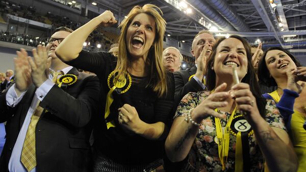 Scottish National Party (SNP) supporters celebrate as election results are announced at the Glasgow election count at the Emirates Arena in Glasgow, Scotland, on May 8, 2015 - Sputnik International