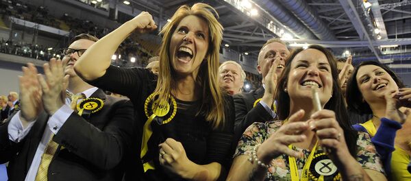 Scottish National Party (SNP) supporters celebrate as election results are announced at the Glasgow election count at the Emirates Arena in Glasgow, Scotland, on May 8, 2015 Scottish National Party (SNP) supporters celebrate as election results are announced at the Glasgow election count at the Emirates Arena in Glasgow, Scotland, on May 8, 2015 - Sputnik International