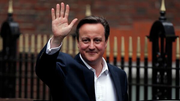 Britain's Prime Minister David Cameron waves as he leaves the Conservative Party headquarters in London, Britain May 8, 2015 - Sputnik International