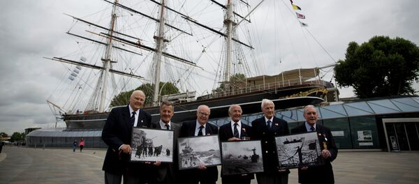 Veterans who served in Britain's Merchant Navy pose with a selection of Royal Mail Merchant Navy stamps during a launch at the Cutty Sark clipper vessel in London, Wednesday, Sept. 18, 2013 Veterans who served in Britain's Merchant Navy pose with a selection of Royal Mail Merchant Navy stamps during a launch at the Cutty Sark clipper vessel in London, Wednesday, Sept. 18, 2013 - Sputnik International