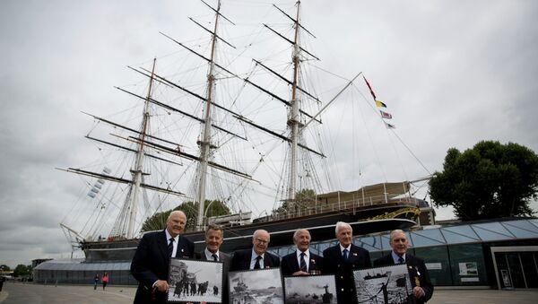 Veterans who served in Britain's Merchant Navy pose with a selection of Royal Mail Merchant Navy stamps during a launch at the Cutty Sark clipper vessel in London, Wednesday, Sept. 18, 2013 - Sputnik International