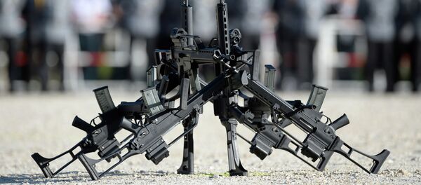 FILE - In this June 5, 2014 file photo G36 rifles of manufacturer Heckler&Koch stand in front of soldiers in Sigmaringen, southern Germany FILE - In this June 5, 2014 file photo G36 rifles of manufacturer Heckler&Koch stand in front of soldiers in Sigmaringen, southern Germany - Sputnik International