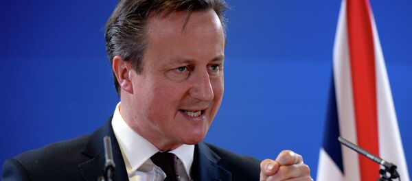 British Prime Minister David Cameron talks to the media at the end of a European Union Summit held at the EU Council building in Brussels - Sputnik International