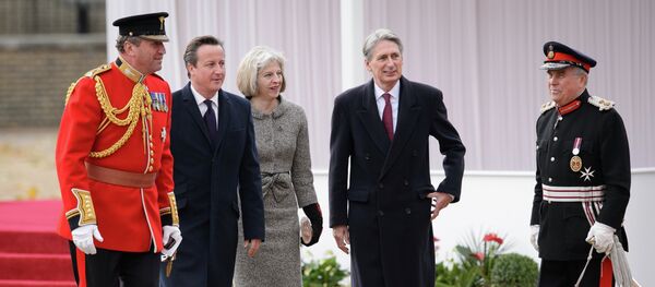 British Prime Minister David Cameron (2L), Home Secretary Theresa May (C) and Foreign Secretary Philip Hammond (2R) British Prime Minister David Cameron (2L), Home Secretary Theresa May (C) and Foreign Secretary Philip Hammond (2R) - Sputnik International