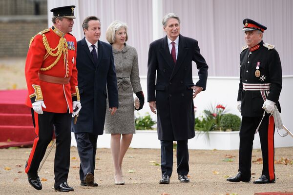 David Cameron (2L), Theresa May (C) and Philip Hammond (2R) David Cameron (2L), Theresa May (C) and Philip Hammond (2R) - Sputnik International