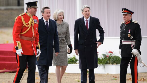 British Prime Minister David Cameron (2L), Home Secretary Theresa May (C) and Foreign Secretary Philip Hammond (2R) - Sputnik International