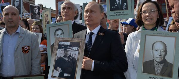 Russian President Vladimir Putin participates in march of Immortal Regiment in downtown Moscow - Sputnik International