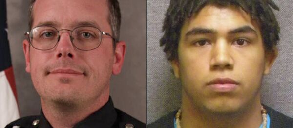 Prosecutors in Wisconsin announced Tuesday that they will not press charges against the white Madison police officer who shot and killed a biracial teenager, Tony Robinson, in March. - Sputnik International