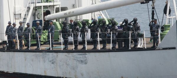 The Philippine Coast Guard personnel salute coast guard officials following a combined maritime exercise by Philippine and Japanese Coast Guards. The Philippine Coast Guard personnel salute coast guard officials following a combined maritime exercise by Philippine and Japanese Coast Guards. - Sputnik International