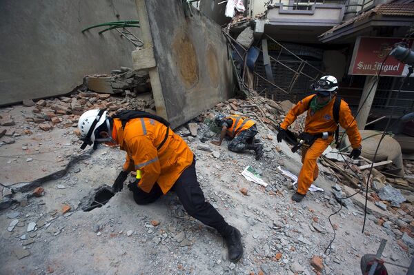 Nepalese military personnel and International rescue check on a collapsed building after an earthquake in the centre of Kathmandu, Nepal Nepalese military personnel and International rescue check on a collapsed building after an earthquake in the centre of Kathmandu, Nepal - Sputnik International