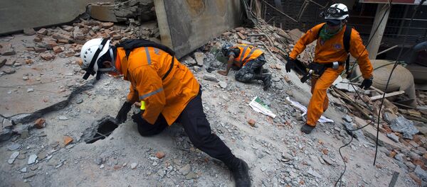 Nepalese military personnel and International rescue check on a collapsed building after an earthquake in the centre of Kathmandu, Nepal Nepalese military personnel and International rescue check on a collapsed building after an earthquake in the centre of Kathmandu, Nepal - Sputnik International