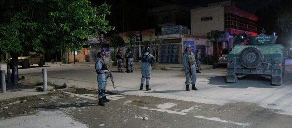 Afghan security forces inspect the site of a Park Palace Hotel attack by Taliban militants, in Kabul, Afghanistan, Wednesday, May 13, 2015 Afghan security forces inspect the site of a Park Palace Hotel attack by Taliban militants, in Kabul, Afghanistan, Wednesday, May 13, 2015 - Sputnik International