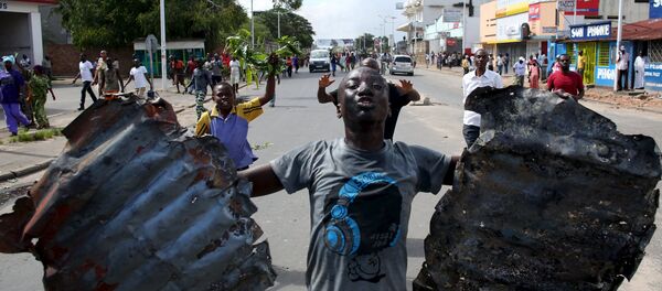 A man celebrates in a street in Bujumbura, Burundi, May 13, 2015 A man celebrates in a street in Bujumbura, Burundi, May 13, 2015 - Sputnik International