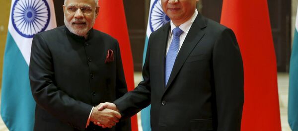 Indian Prime Minister Narendra Modi (L) and Chinese President Xi Jinping shake hands before they hold a meeting in Xian, Shaanxi province, China, May 14, 2015 Indian Prime Minister Narendra Modi (L) and Chinese President Xi Jinping shake hands before they hold a meeting in Xian, Shaanxi province, China, May 14, 2015 - Sputnik International