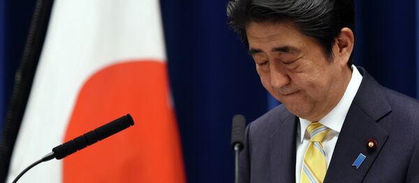 Japan's Prime Minister Shinzo Abe bows at the end of his press conference following a cabinet meeting which approved a set of bills bolstering the role and scope of the military, at his official residence in Tokyo on May 14, 2015 Japan's Prime Minister Shinzo Abe bows at the end of his press conference following a cabinet meeting which approved a set of bills bolstering the role and scope of the military, at his official residence in Tokyo on May 14, 2015 - Sputnik International