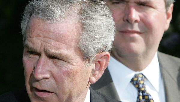 President George W.Bush, left, makes a statement on the Global War on Terror, standing with his brother Jeb Bush. - Sputnik International