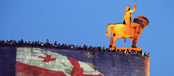 Georgian national and EU flags projected on the wall of the Metekhi Church with a monument to Vakhtang I Gorgasali, a king of Iberia, right, during a concert marking the signing of the association with EU agreement in Tbilisi, Georgia, Friday, June 27, 2014 Georgian national and EU flags projected on the wall of the Metekhi Church with a monument to Vakhtang I Gorgasali, a king of Iberia, right, during a concert marking the signing of the association with EU agreement in Tbilisi, Georgia, Friday, June 27, 2014 - Sputnik International
