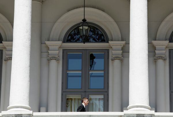 A security guard walks on a balcony at the Coburg Palais in Vienna, on May 12, 2015 - Sputnik International