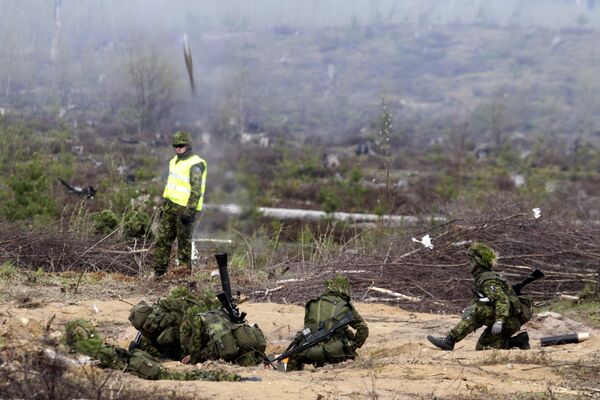 Estonian army soldiers launch grenade during the NATO military exercise Hedgehog 2015 at the Tapa training range in Estonia May 12, 2015 Estonian army soldiers launch grenade during the NATO military exercise Hedgehog 2015 at the Tapa training range in Estonia May 12, 2015 - Sputnik International
