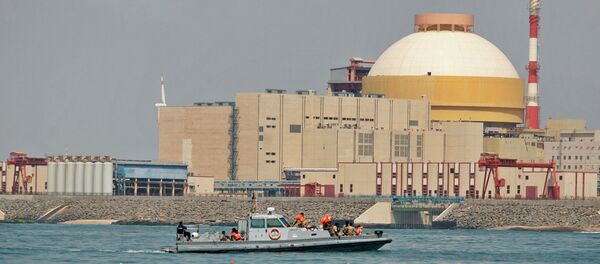 Indian coast guards ride on a boat near the Russian-built Kudankulam Atomic Power Project, background, during a protest at Kudankulam, about 700 kilometers (440 miles) south of Chennai, Tamil Nadu state, India - Sputnik International