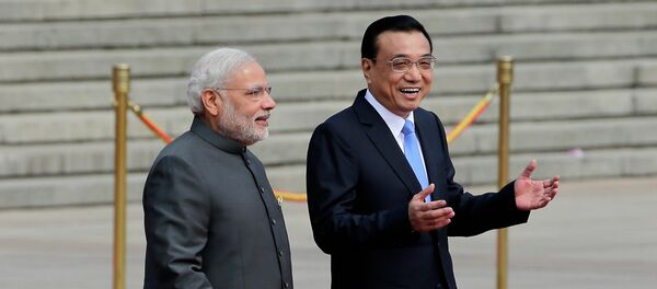 India's Prime Minister Narendra Modi, left, chats with Chinese Premier Li Keqiang during a welcome ceremony outside the Great Hall of the People in Beijing, China, Friday, May 15, 2015. - Sputnik International