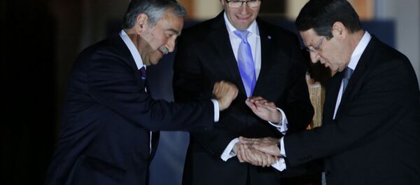 Cyprus' president Nicos Anastasiades, right, Turkish Cypriot leader Mustafa Akinci, left, and United Nations envoy Espen Barth Eide shake hands. Cyprus' president Nicos Anastasiades, right, Turkish Cypriot leader Mustafa Akinci, left, and United Nations envoy Espen Barth Eide shake hands. - Sputnik International