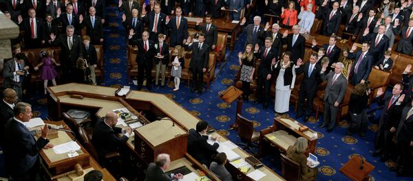 Speaker of the House John Boehner(L),R-OH, swears in members of the House during a ceremony in the House of Representatives as the 114th Congress convenes on Capitol Hill January 6, 2015 in Washington Speaker of the House John Boehner(L),R-OH, swears in members of the House during a ceremony in the House of Representatives as the 114th Congress convenes on Capitol Hill January 6, 2015 in Washington - Sputnik International