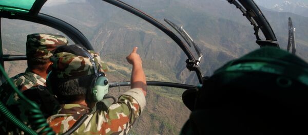 Nepalese army men search for the missing U.S. Marine helicopter in the earthquake affected Dolakha District, Nepal, Thursday, May 14, 2015 Nepalese army men search for the missing U.S. Marine helicopter in the earthquake affected Dolakha District, Nepal, Thursday, May 14, 2015 - Sputnik International