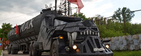 Mad Max arriving in Lugansk, flying the flag of the self-proclaimed Lugansk People's Republic. Mad Max arriving in Lugansk, flying the flag of the self-proclaimed Lugansk People's Republic. - Sputnik International