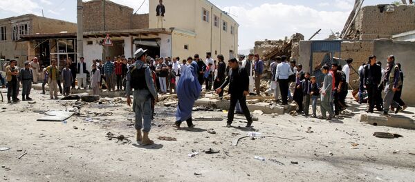 Afghan security forces inspect the site of suicide attack near an international airport in Kabul, Afghanistan, Sunday, May 17, 2015 Afghan security forces inspect the site of suicide attack near an international airport in Kabul, Afghanistan, Sunday, May 17, 2015 - Sputnik International