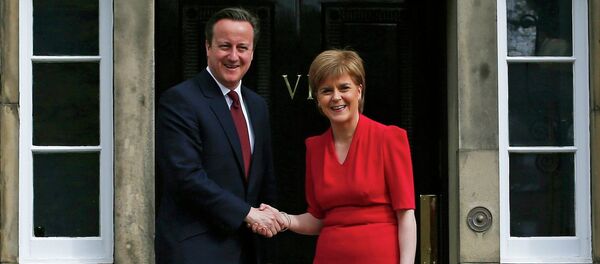 Scotland's First Minister Nicola Sturgeon (R), greets Britain's Prime Minister David Cameron, as he arrives for their meeting in Edinburgh, Scotland, Britain May 15, 2015 - Sputnik International