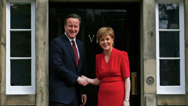 Scotland's First Minister Nicola Sturgeon (R), greets Britain's Prime Minister David Cameron, as he arrives for their meeting in Edinburgh, Scotland, Britain May 15, 2015 - Sputnik International