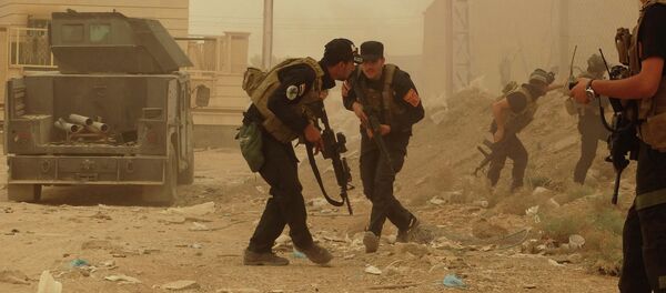 Security forces defend their headquarters against attacks by Islamic State extremists during sand storm in the eastern part of Ramadi, the capital of Anbar province, 115 kilometers (70 miles) west of Baghdad, Iraq, Thursday, May 14, 2015 Security forces defend their headquarters against attacks by Islamic State extremists during sand storm in the eastern part of Ramadi, the capital of Anbar province, 115 kilometers (70 miles) west of Baghdad, Iraq, Thursday, May 14, 2015 - Sputnik International