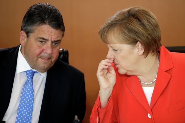 German Chancellor Angela Merkel speaks to the Vice-Chancellor Sigmar Gabriel. German Chancellor Angela Merkel speaks to the Vice-Chancellor Sigmar Gabriel. - Sputnik International