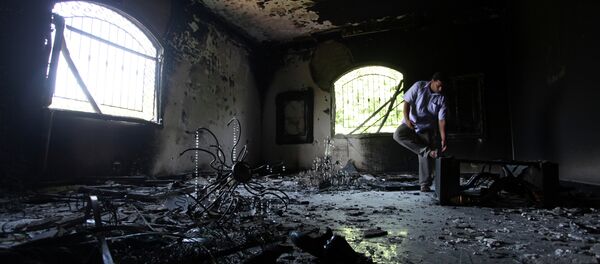 A Libyan man investigates the inside of the U.S. Consulate after an attack that killed four Americans. A Libyan man investigates the inside of the U.S. Consulate after an attack that killed four Americans. - Sputnik International